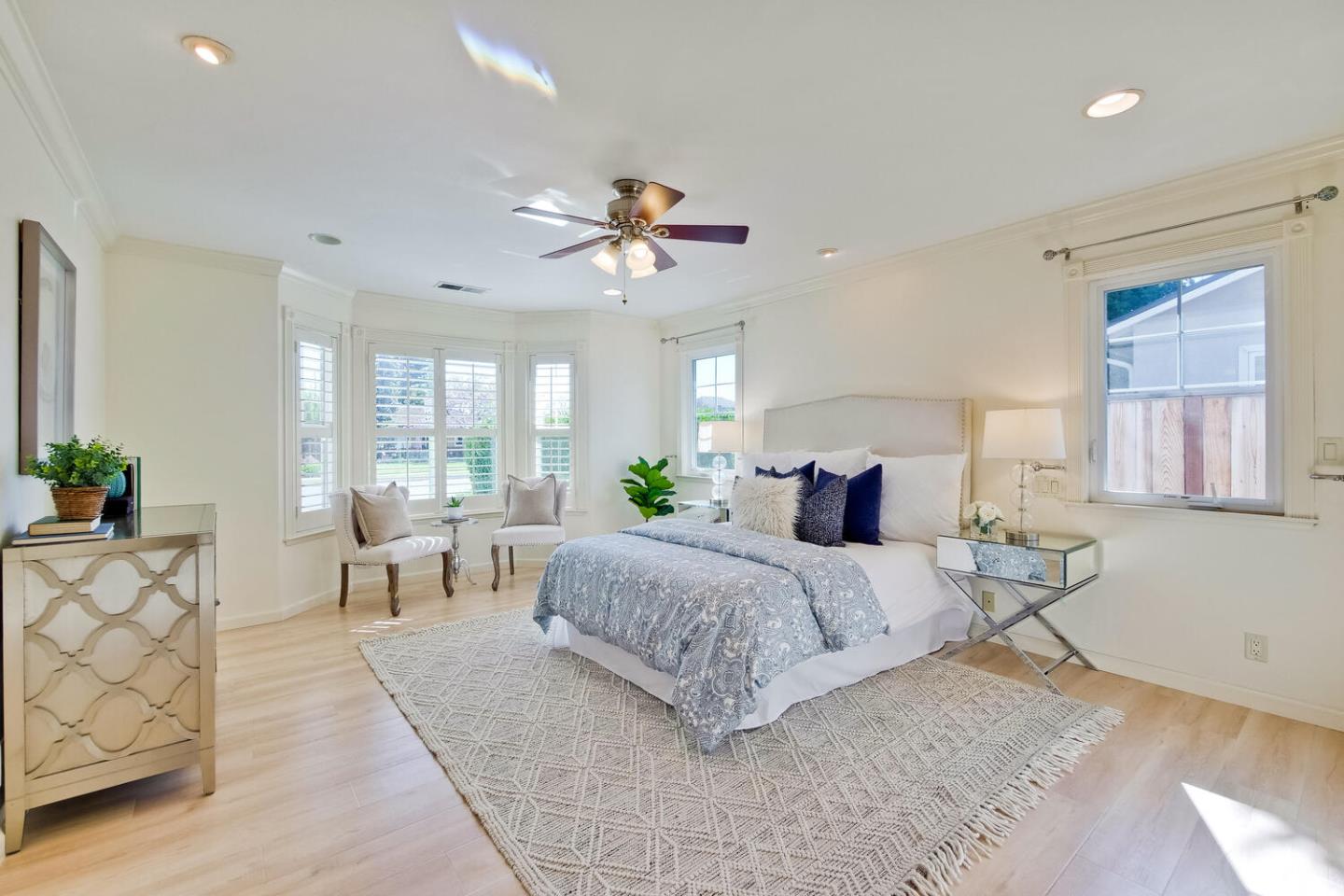 735 Widget Drive San Jose, CA 95117 - Photo 22 of 48 a bedroom with a bed and a chandelier