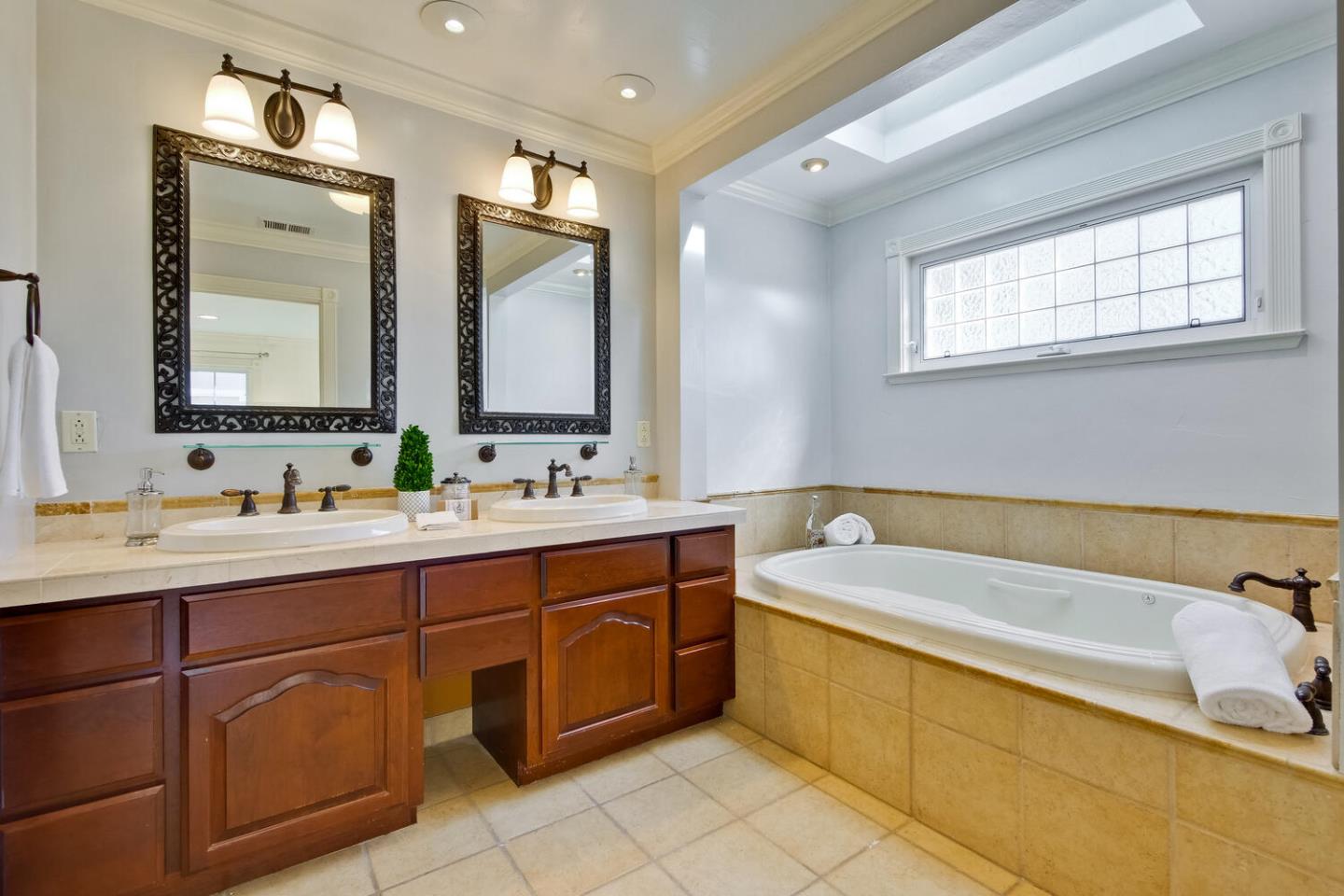 735 Widget Drive San Jose, CA 95117 - Photo 26 of 48 a spacious bathroom with a tub sink and mirror