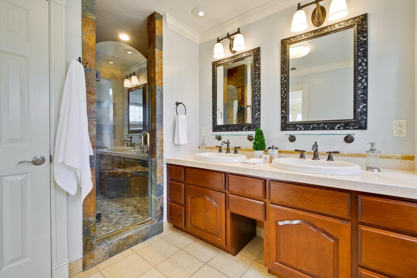 735 Widget Drive San Jose, CA 95117 - Photo 29 of 48 a bathroom with a shower sink and mirror