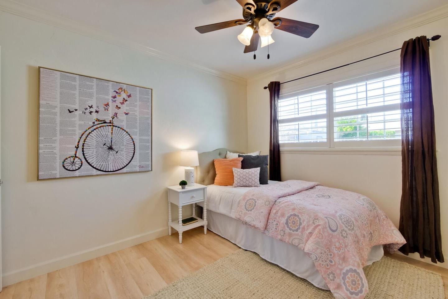 735 Widget Drive San Jose, CA 95117 - Photo 36 of 48 a bedroom with a large bed and a chandelier