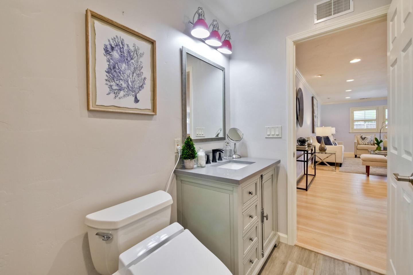 735 Widget Drive San Jose, CA 95117 - Photo 40 of 48 a bathroom with a toilet sink and mirror