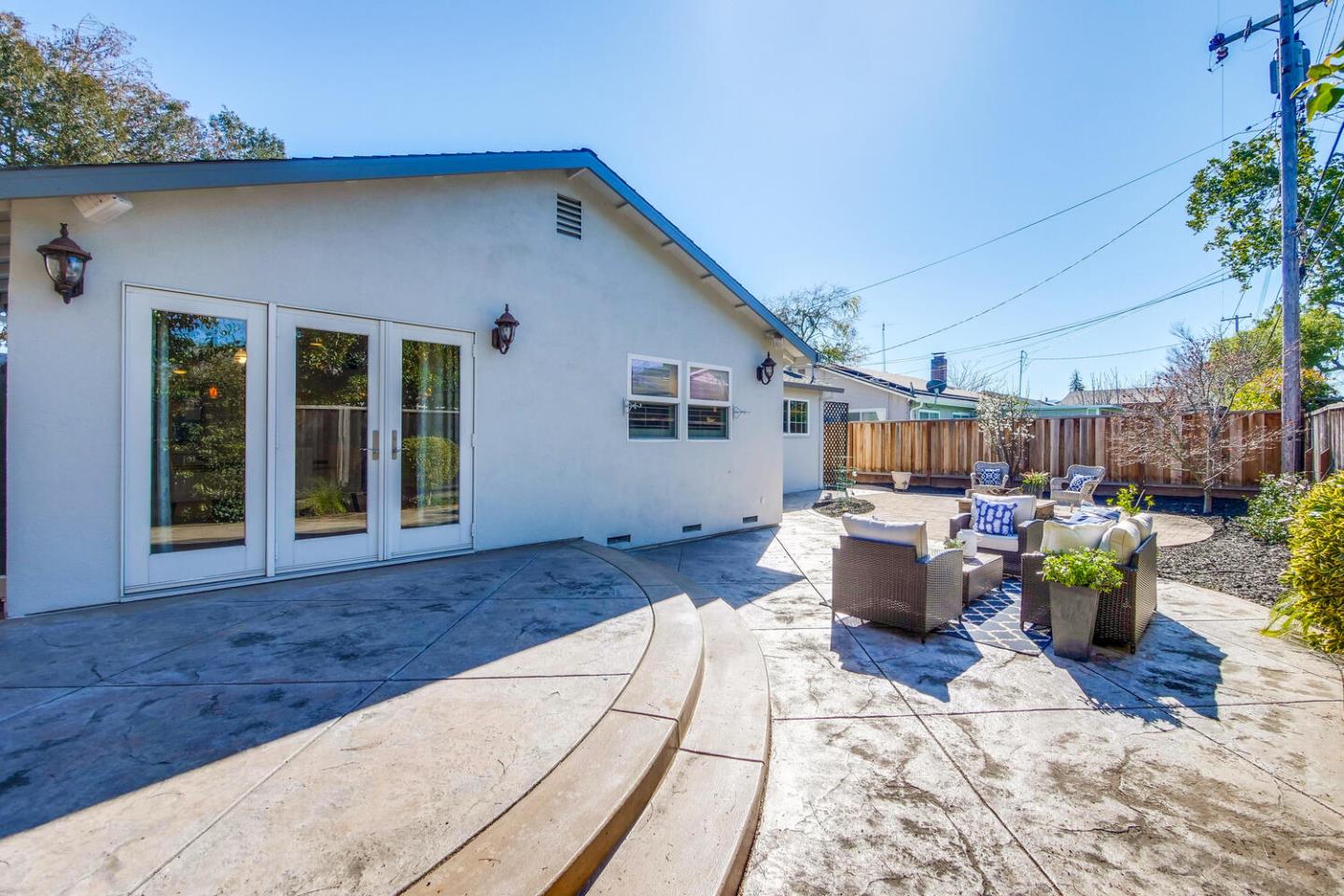 735 Widget Drive San Jose, CA 95117 - Photo 45 of 48 a view of a patio with couches table and chairs and potted plants