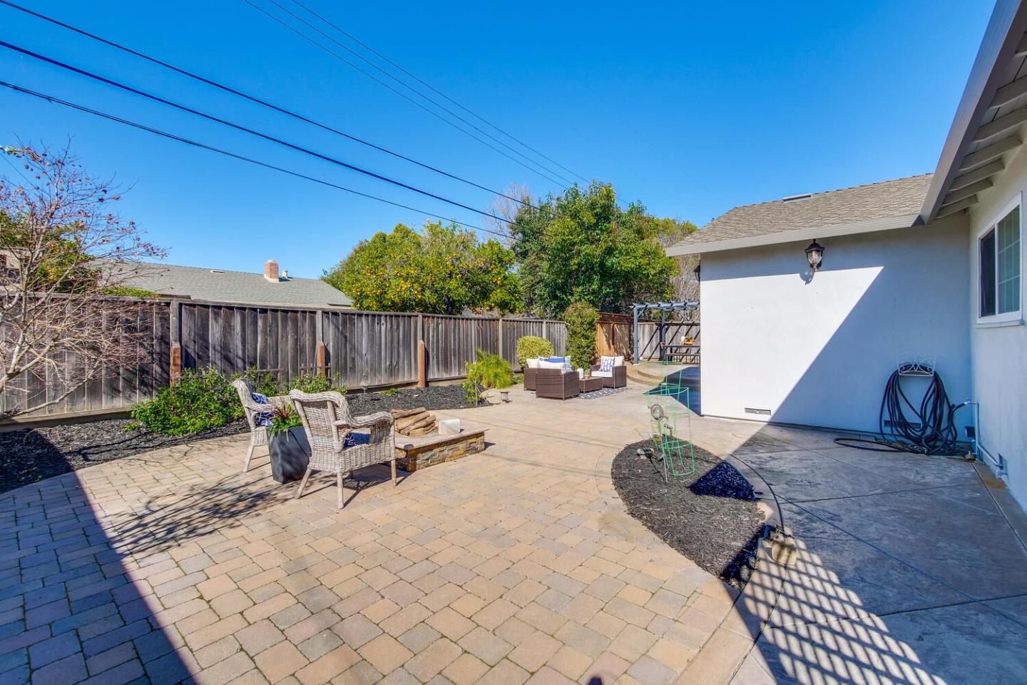 735 Widget Drive San Jose, CA 95117 - Photo 47 of 48 a view of backyard with a table and chairs
