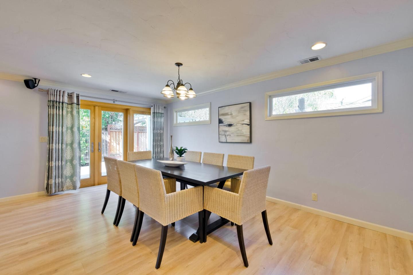 735 Widget Drive San Jose, CA 95117 - Photo 8 of 48 a view of a dining room with furniture window and wooden floor