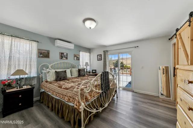 a bed room with a bed window and a table