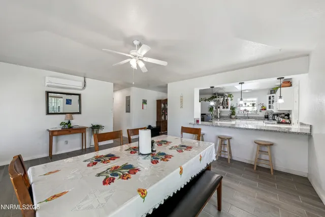 a very nice looking dining room with a table and chairs