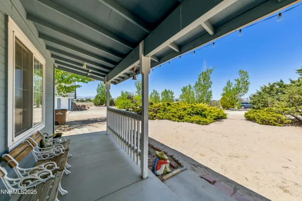 a view of a porch with furniture