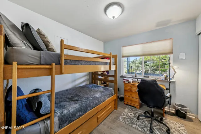 a bedroom with furniture and a window