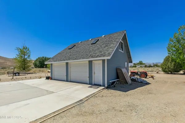 a backyard of a house with yard and garage