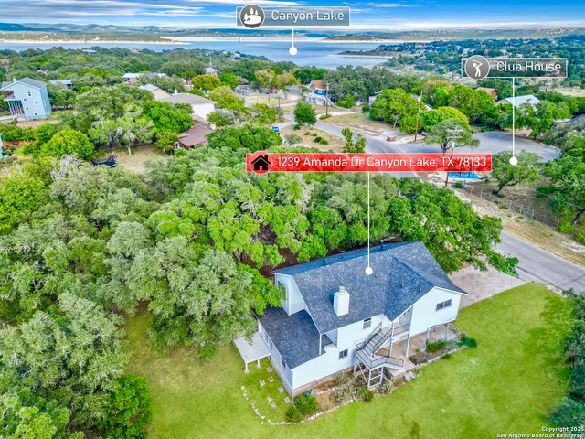a view of a table and chairs in the garden