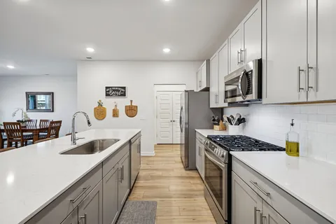 a view of a hallway with washer and dryer