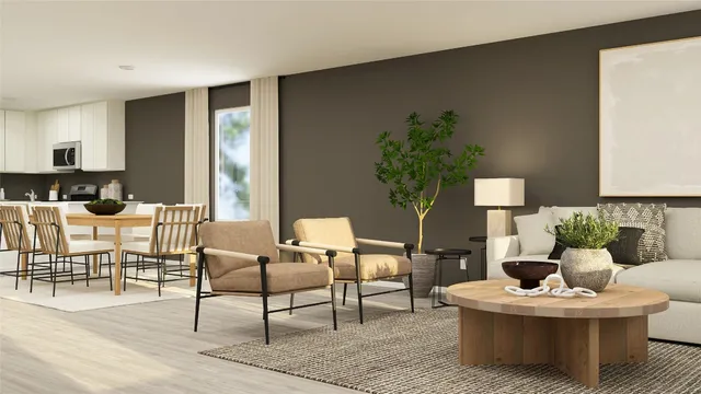 a living room with furniture and a potted plant