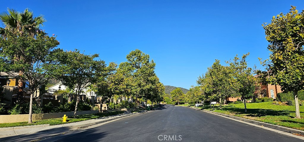 4182 Jameson Drive Corona, CA 92881 - Photo 14 of 19 a view of a street with a building and a street sign