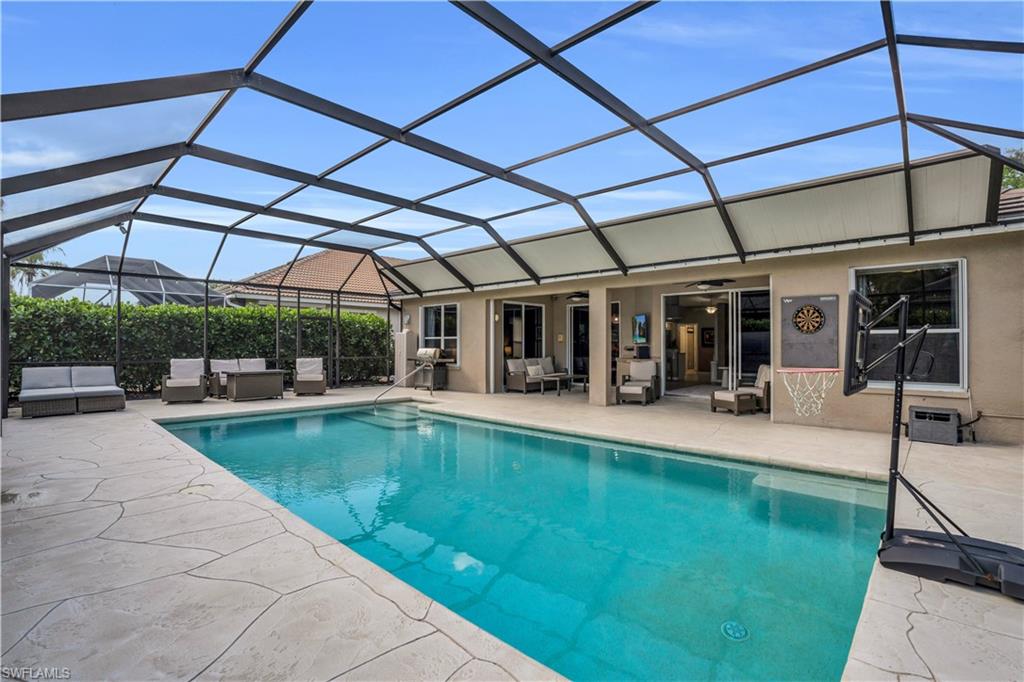 4356 Mistlethrush Lane Naples, FL 34119 - Photo 28 of 38 a view of a swimming pool with a patio