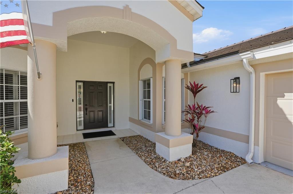 4356 Mistlethrush Lane Naples, FL 34119 - Photo 3 of 38 a front view of a house