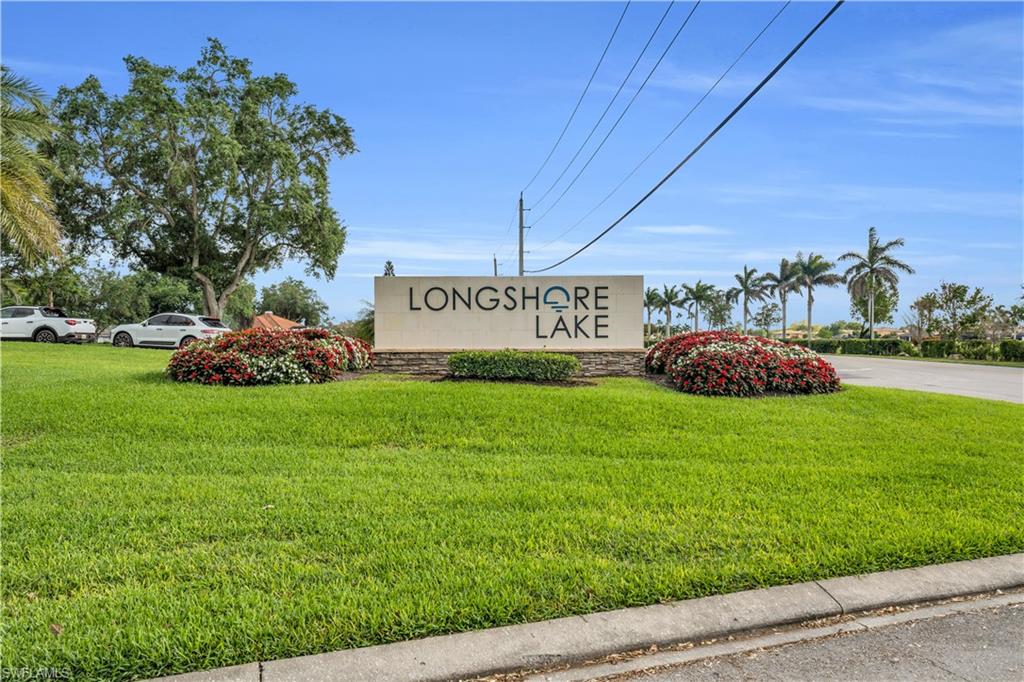 4356 Mistlethrush Lane Naples, FL 34119 - Photo 31 of 38 a sign that is sitting in the grass