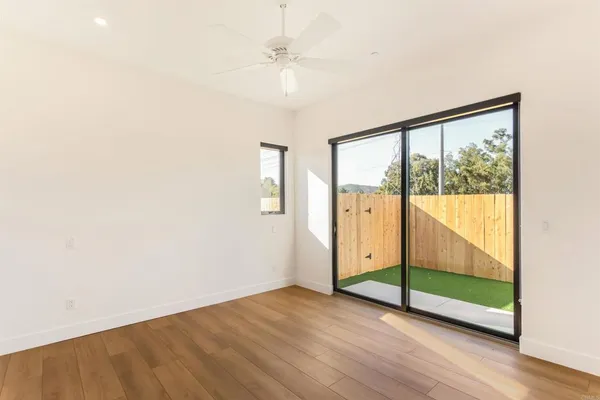 a view of an empty room with a window
