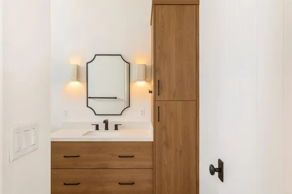 a bathroom with a sink and a mirror