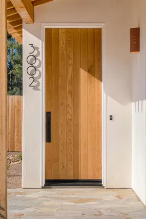 a view of a door with wooden floor