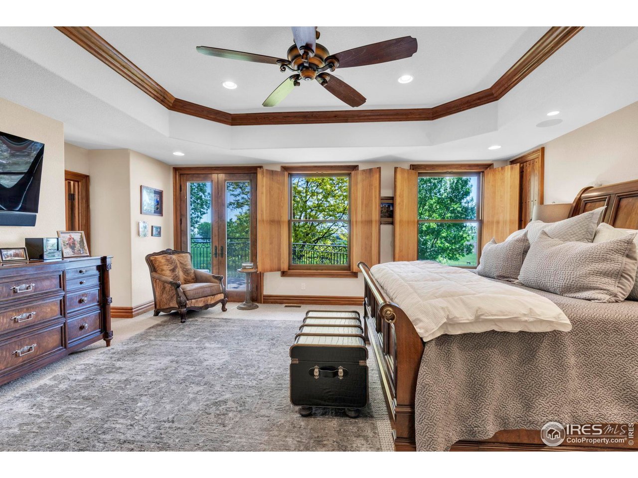 20360 County Road 3 Berthoud, CO 80513 - Photo 13 of 40 a bedroom with furniture and large windows