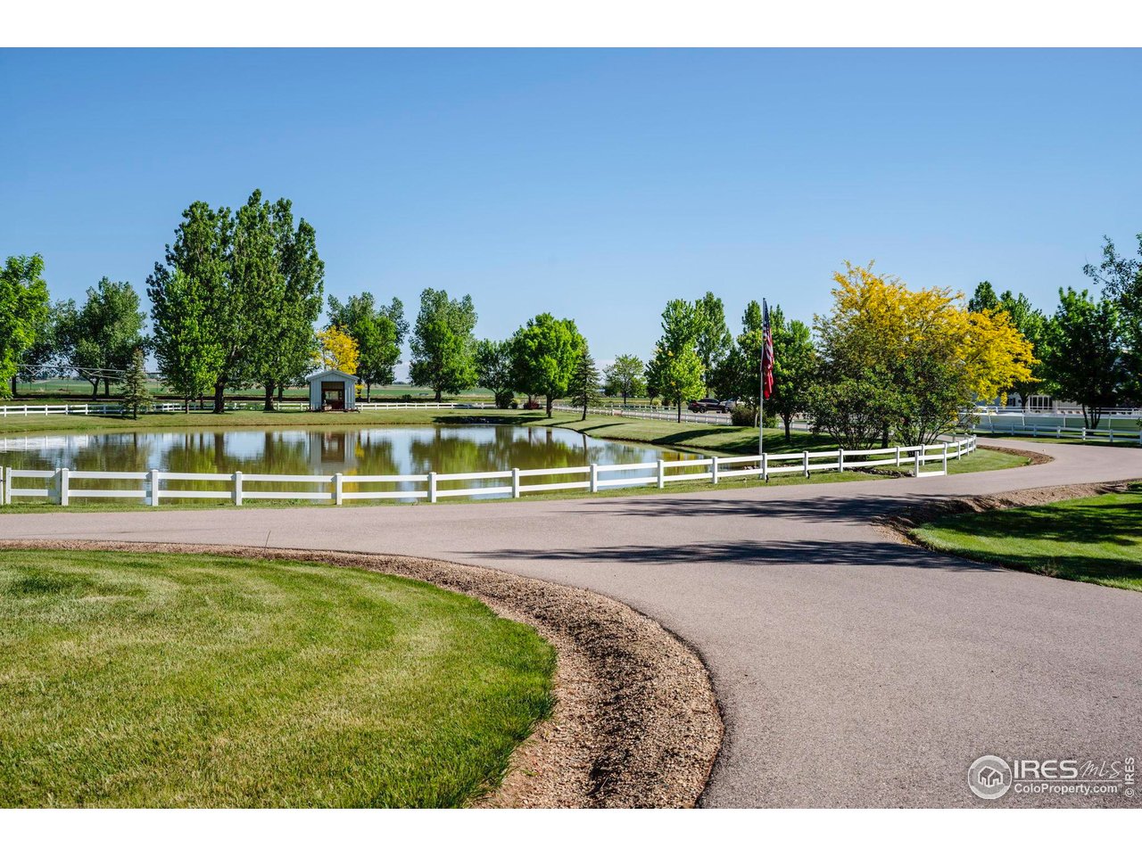 20360 County Road 3 Berthoud, CO 80513 - Photo 27 of 40 a view of a swimming pool with an outdoor space and seating area