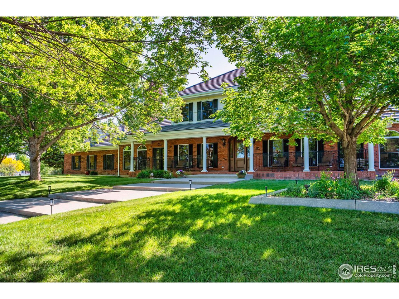 20360 County Road 3 Berthoud, CO 80513 - Photo 3 of 40 a front view of a house with a yard