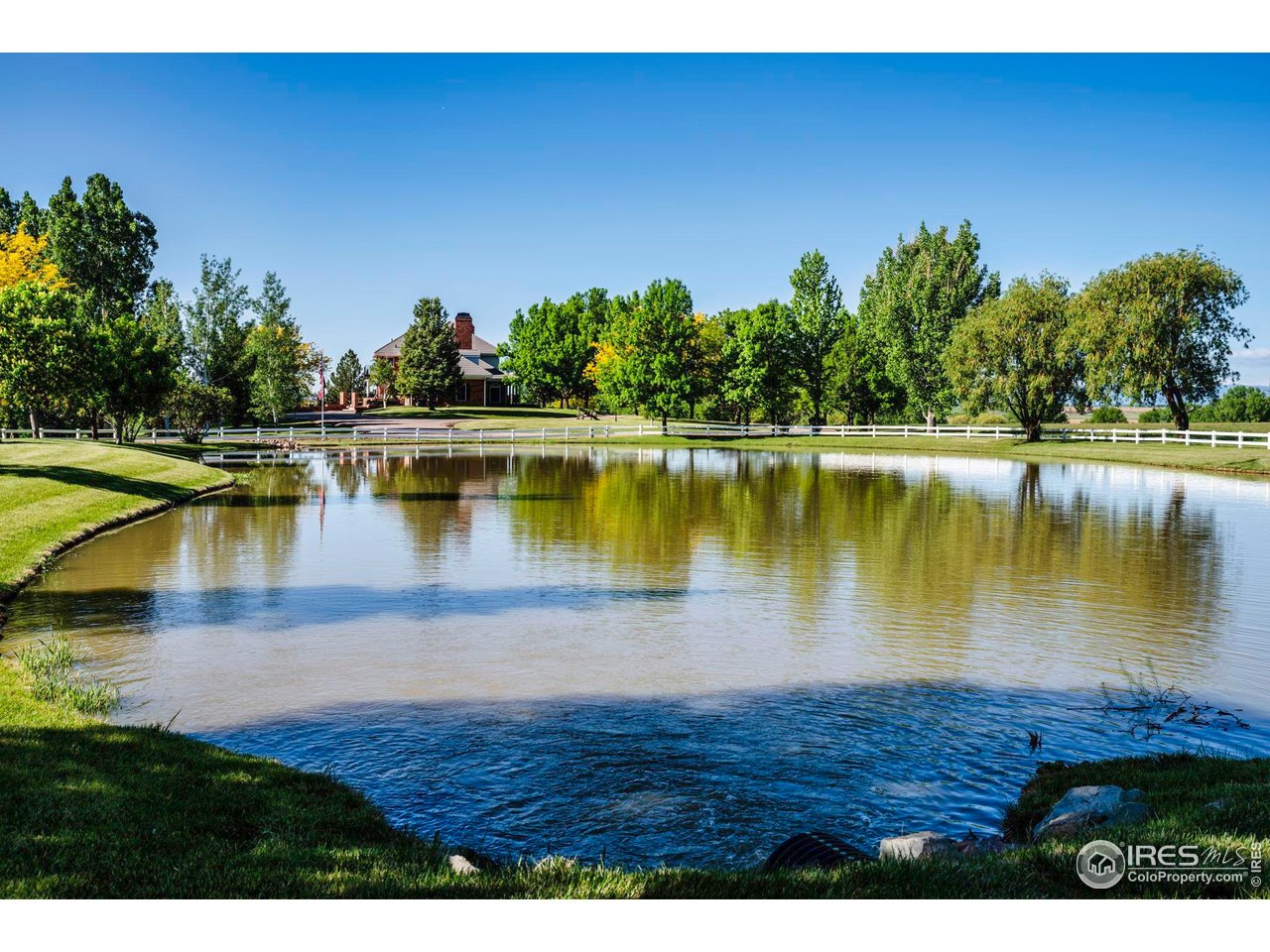 20360 County Road 3 Berthoud, CO 80513 - Photo 4 of 40 a view of a lake with houses in the back