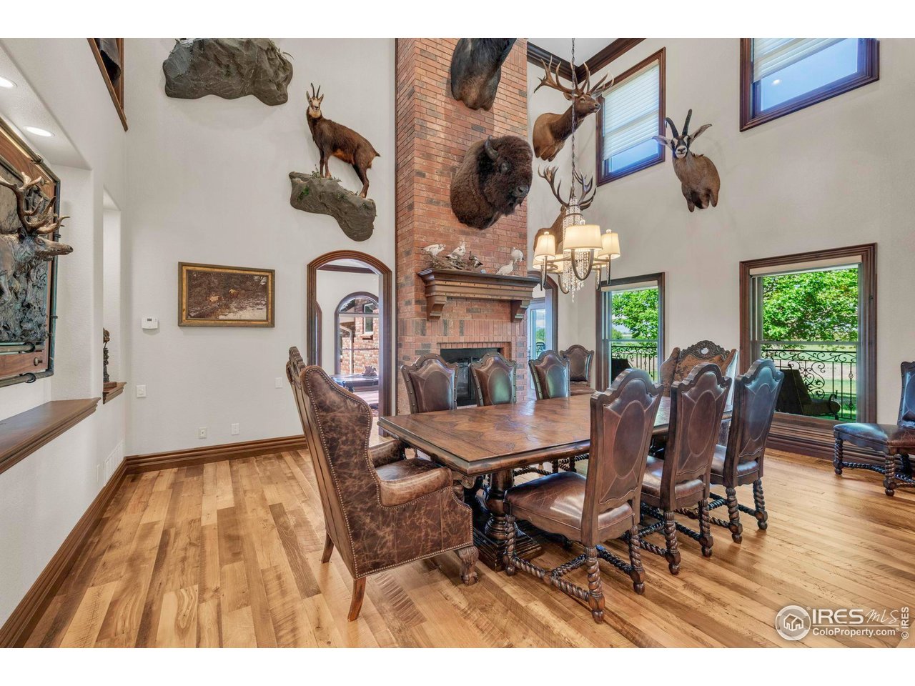 20360 County Road 3 Berthoud, CO 80513 - Photo 6 of 40 a view of a dining room with furniture window and wooden floor