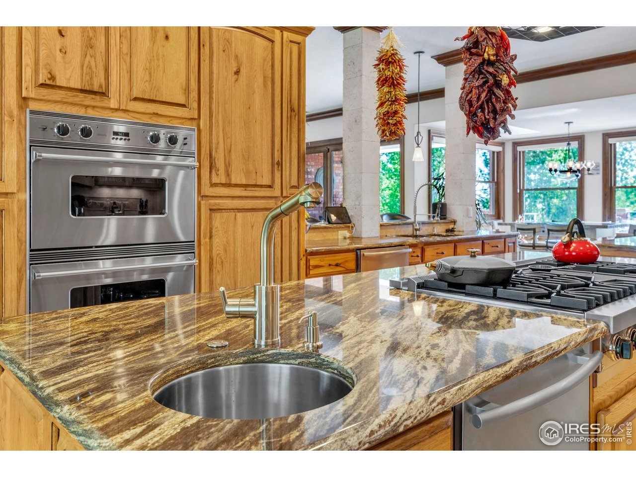 20360 County Road 3 Berthoud, CO 80513 - Photo 9 of 40 a kitchen with stainless steel appliances granite countertop a sink and a refrigerator