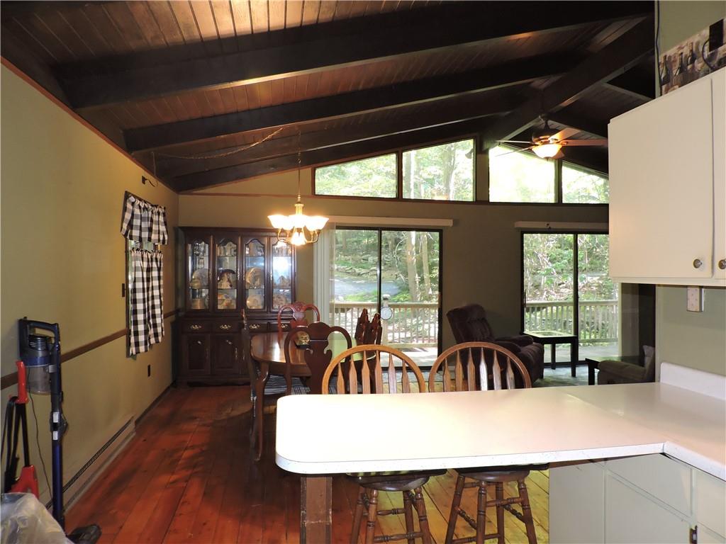 155 Maple Road Acme, PA 15610 - Photo 11 of 39 a view of a dining room with furniture window and outside view