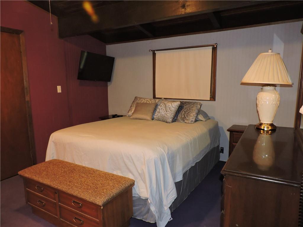 155 Maple Road Acme, PA 15610 - Photo 18 of 39 a bedroom with a bed and a television