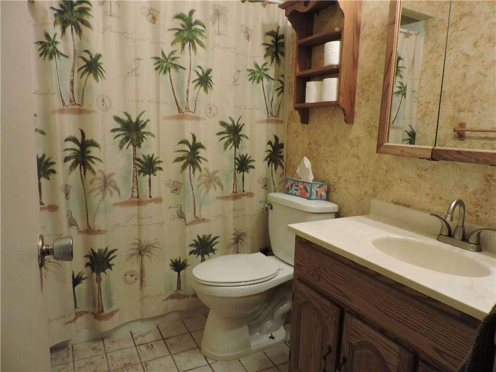 155 Maple Road Acme, PA 15610 - Photo 19 of 39 a bathroom with a toilet sink and mirror