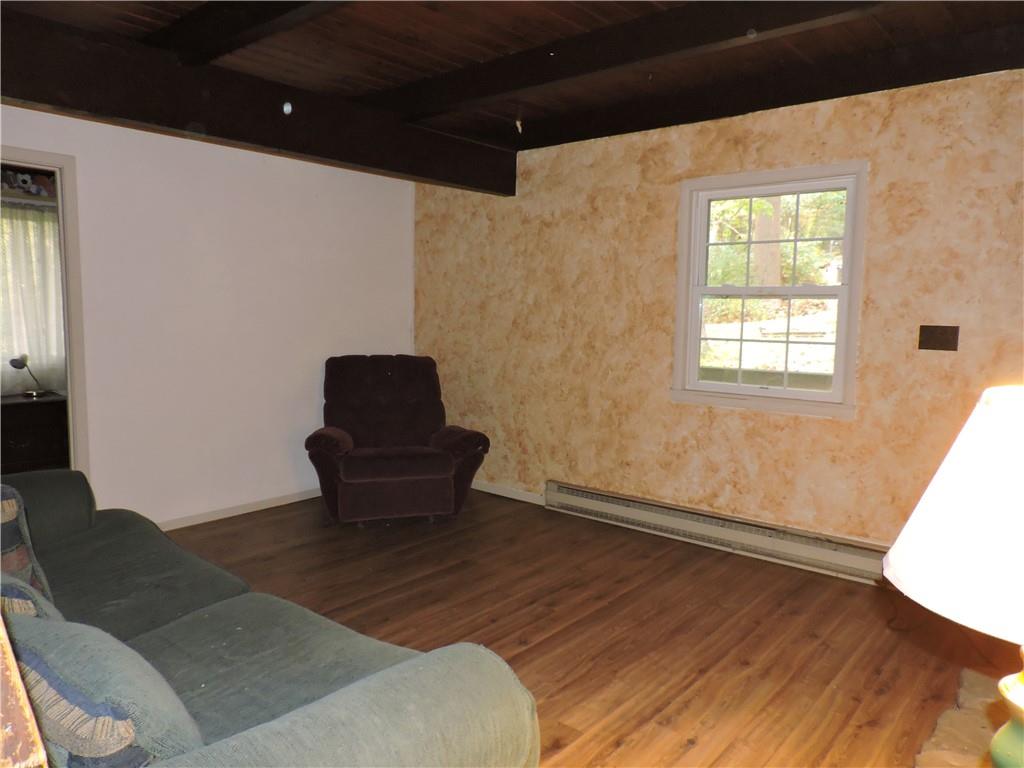 155 Maple Road Acme, PA 15610 - Photo 23 of 39 a living room with a couch and a window
