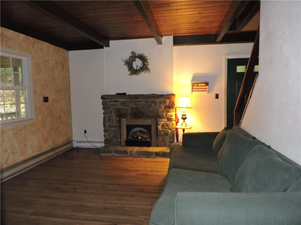 155 Maple Road Acme, PA 15610 - Photo 24 of 39 a living room with furniture and a fireplace