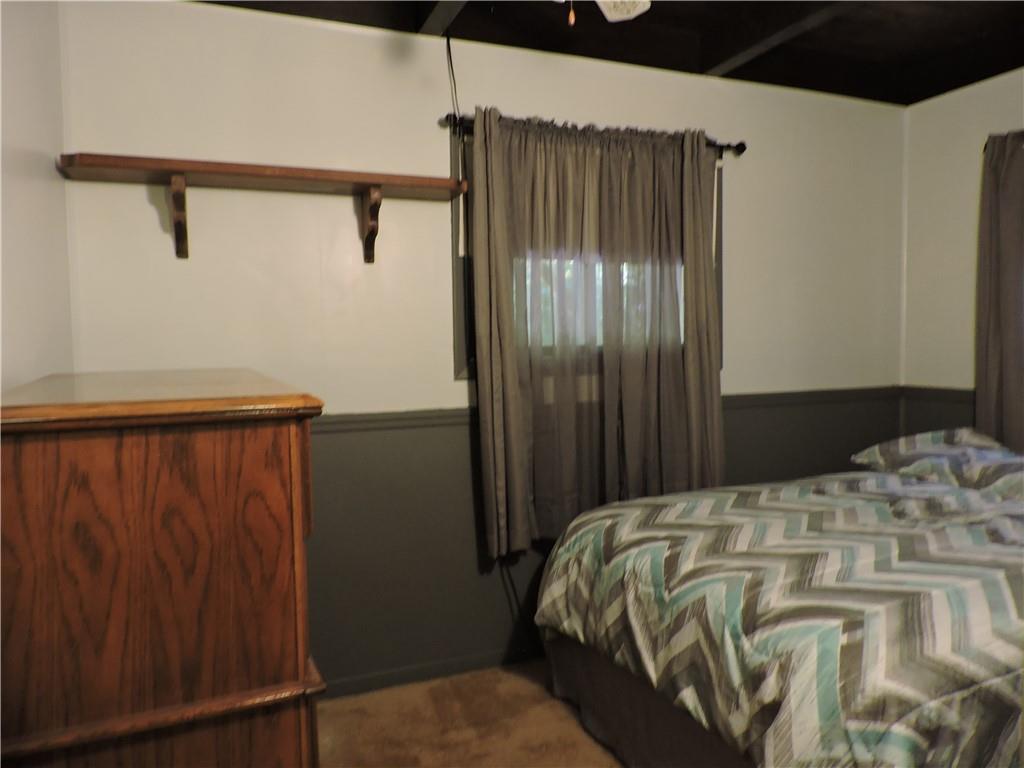 155 Maple Road Acme, PA 15610 - Photo 32 of 39 a bedroom with a bed and a cabinet