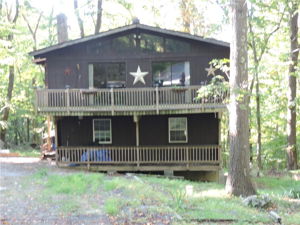 155 Maple Road Acme, PA 15610 - Photo 36 of 39 a view of a house with a deck and a yard