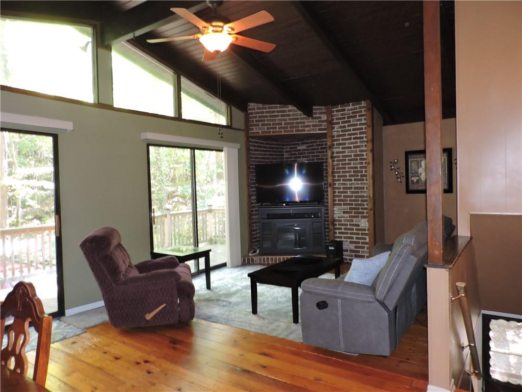 155 Maple Road Acme, PA 15610 - Photo 5 of 39 a living room with furniture and a flat screen tv
