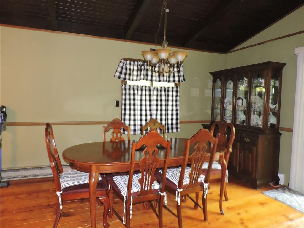 155 Maple Road Acme, PA 15610 - Photo 6 of 39 a view of a dining room with furniture and chandelier