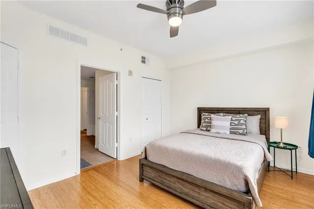 a bedroom with a bed and a table