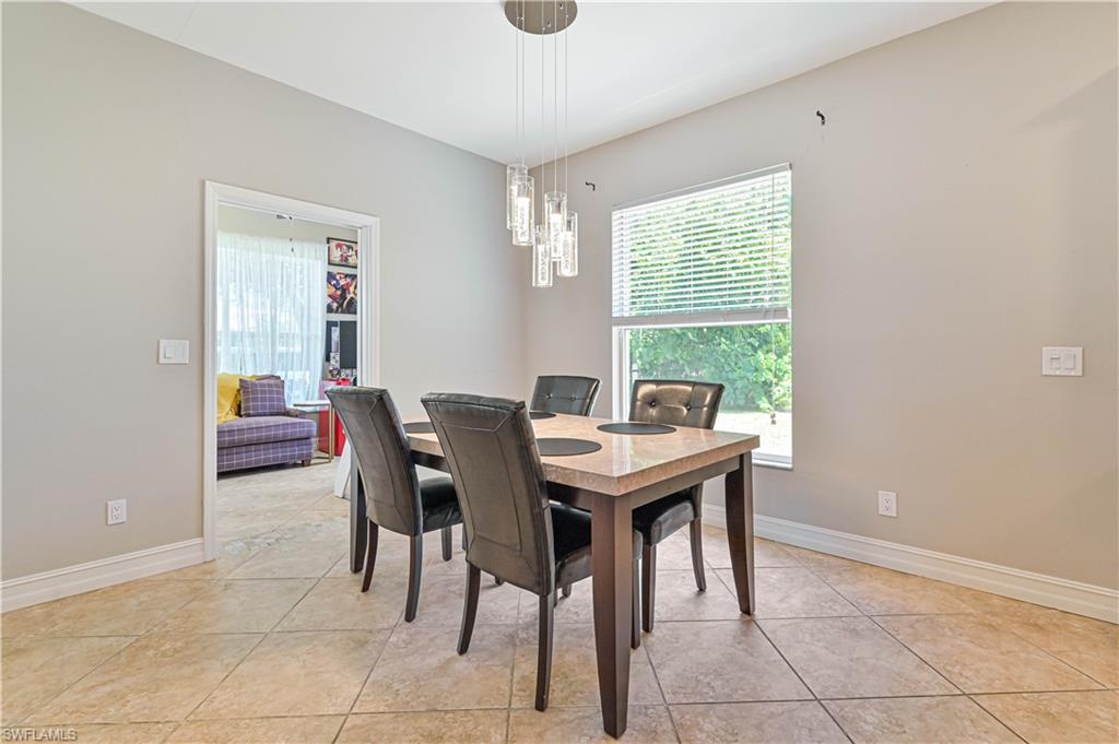 238 Stanhope Circle Naples, FL 34104 - Photo 12 of 33 a view of a dining room with furniture and a window