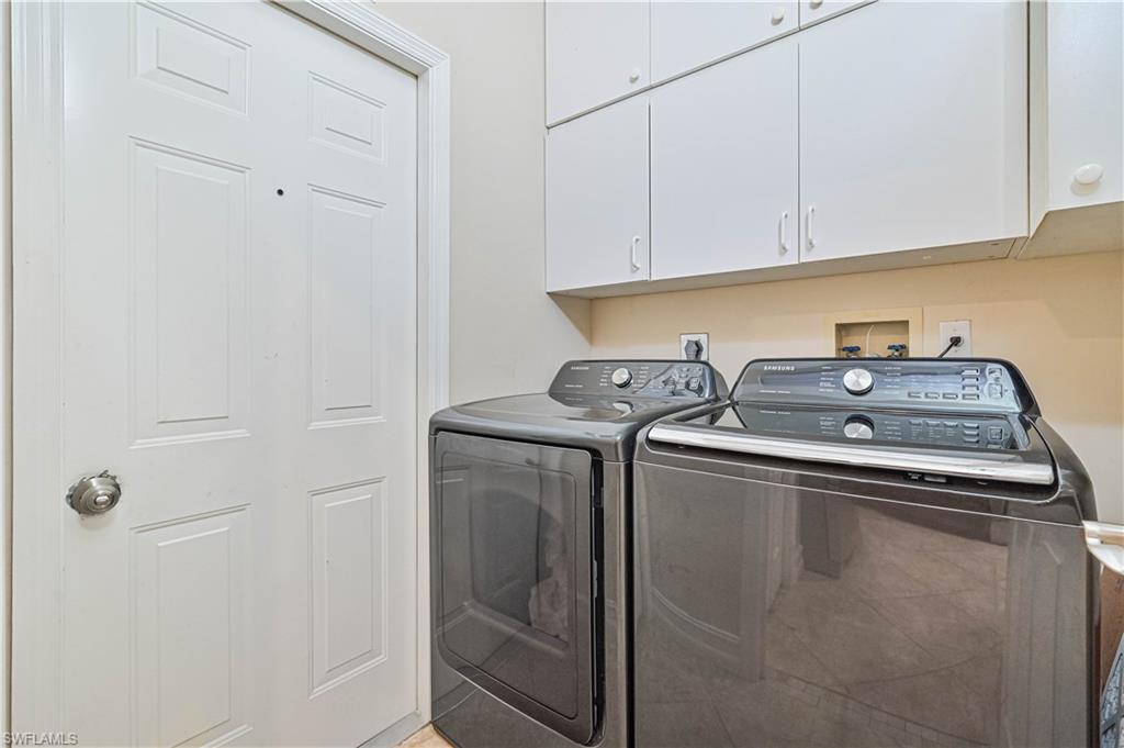 238 Stanhope Circle Naples, FL 34104 - Photo 19 of 33 a utility room with dryer and washer