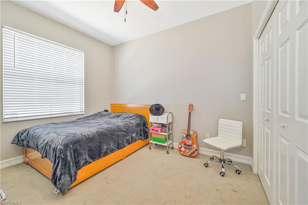 238 Stanhope Circle Naples, FL 34104 - Photo 26 of 33 a bedroom with bed and a window
