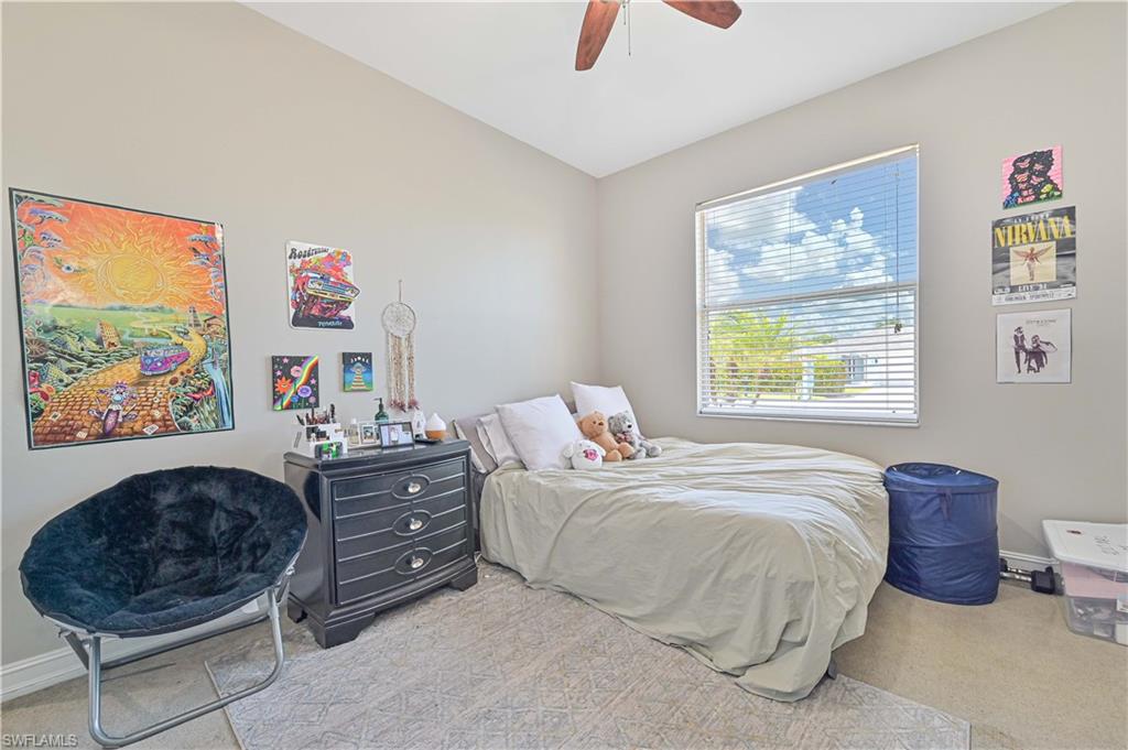 238 Stanhope Circle Naples, FL 34104 - Photo 29 of 33 a bedroom with a bed dresser and a window