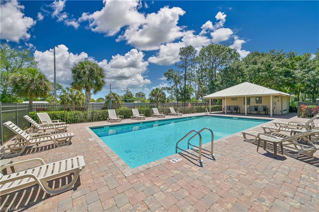 238 Stanhope Circle Naples, FL 34104 - Photo 31 of 33 a view of swimming pool with outdoor seating and yard in back