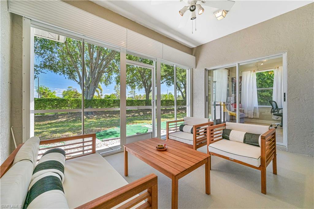 238 Stanhope Circle Naples, FL 34104 - Photo 8 of 33 a living room with furniture and a large window