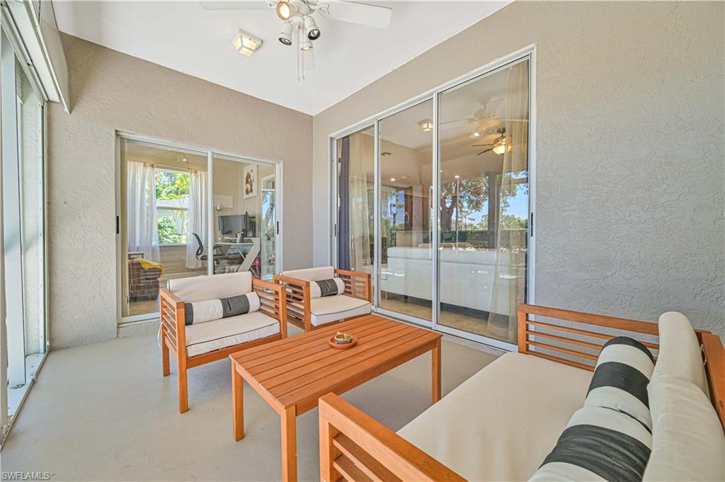 238 Stanhope Circle Naples, FL 34104 - Photo 9 of 33 a living room with furniture and a window