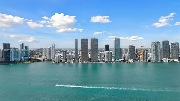 a view of a city with tall buildings in the background