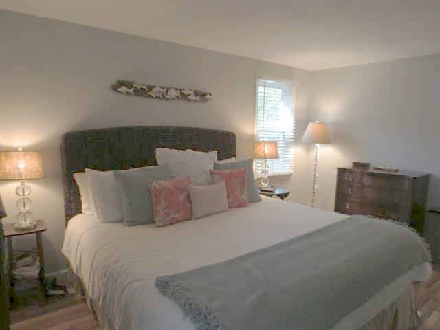 502 Skunknet Road Centerville, MA 02632 - Photo 11 of 24 a bedroom with a bed and window