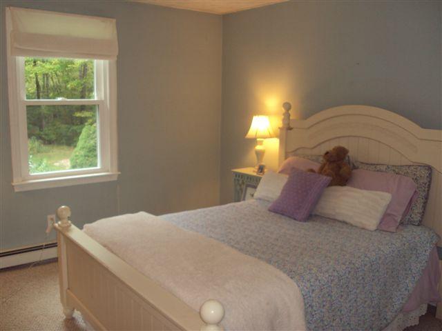 502 Skunknet Road Centerville, MA 02632 - Photo 14 of 24 a bedroom with a bed and window
