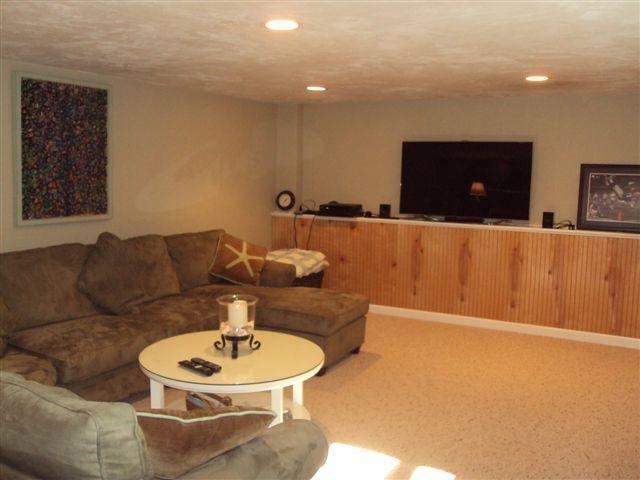 502 Skunknet Road Centerville, MA 02632 - Photo 7 of 24 a living room with furniture and a flat screen tv